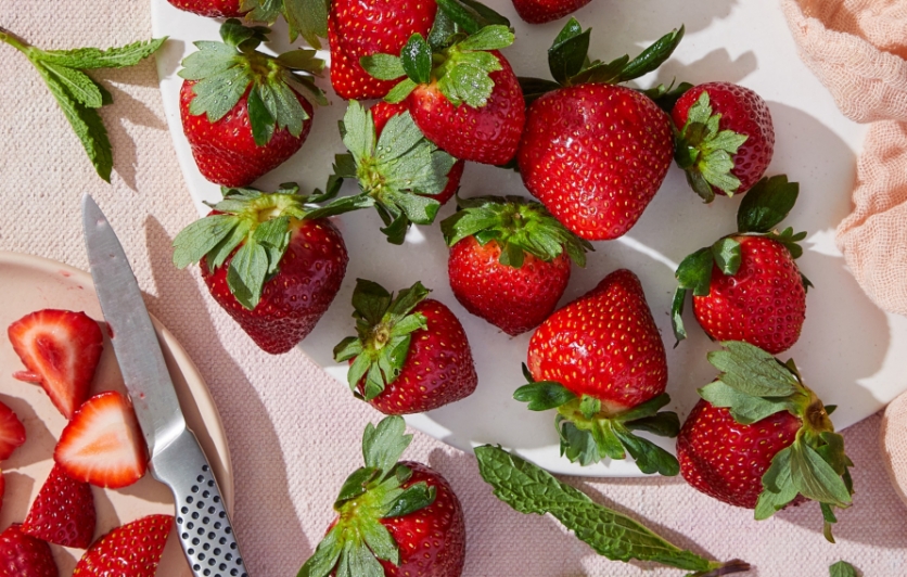whole strawberries on a tablecloth