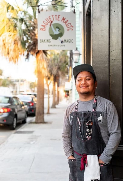 chef stands outside restaurant in Charleston