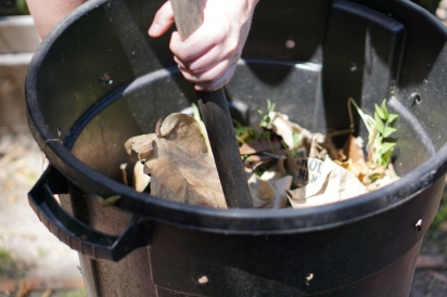 trash can with compost materials inside