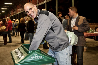 man recycling in a bin