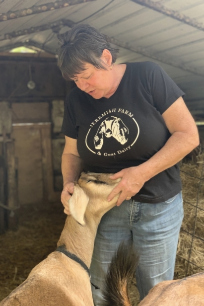 Casey Price of Jeremiah Farm Goat Dairy with goat