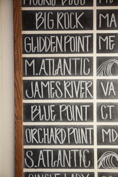 Chalkboard of oyster selections at NICO