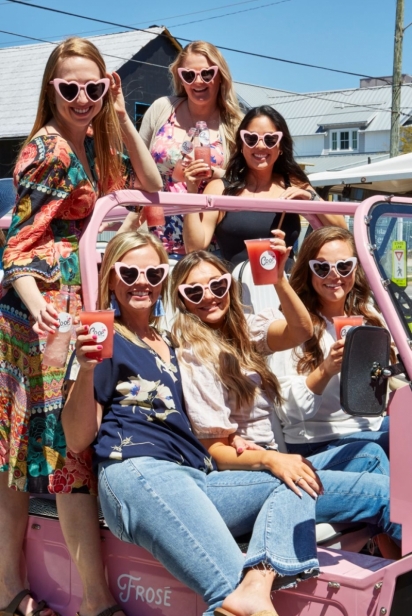 girls in a pink jeep