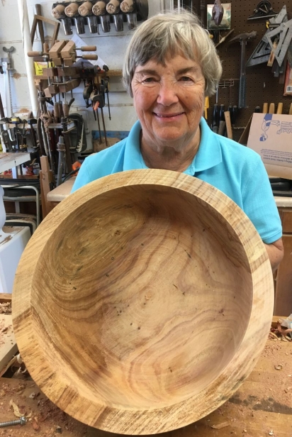 woman holding handmade wooden bowl