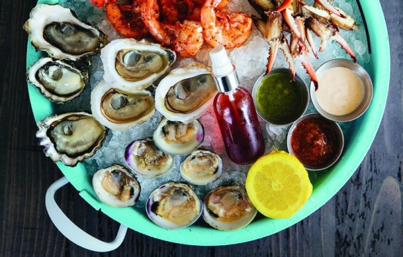 bowl of oysters and shrimp on ice