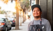 chef stands outside restaurant in Charleston
